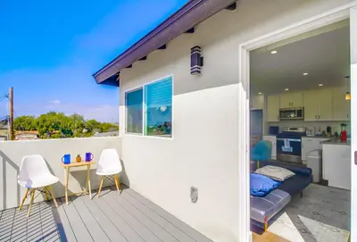 a balcony with a view of a kitchen at Entire Private Home with 3 Bedrooms 3 Bathrooms, Near San Diego Downtown & Beach, Available Now in National City