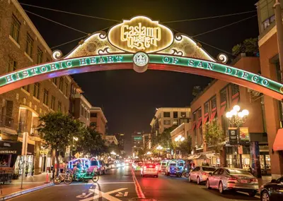 a city street with cars driving under a sign at Entire Private Home with 3 Bedrooms 3 Bathrooms, Near San Diego Downtown & Beach, Available Now in National City