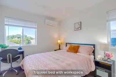 a bedroom with a bed with a desk and a chair at Entire Private Home with 3 Bedrooms 3 Bathrooms, Near San Diego Downtown & Beach, Available Now in National City