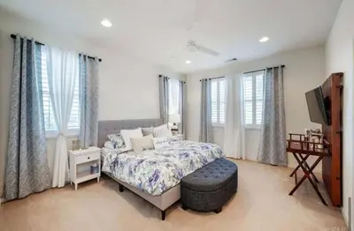 a bedroom with a bed and a flat screen tv at Beautiful Spacious Condo in an Excellent Location in Chula Vista
