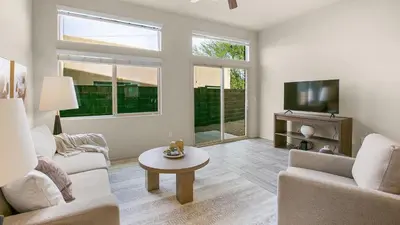 a living room with two couches and a tv at Landing Stylish 1BD Yoga Studio Game Room in Murrieta