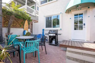 a patio with chairs and a table and a grill at Mission Casa Del Sol in San Diego