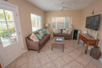 a living room with a couch and a table at Mission Casa Del Sol in San Diego