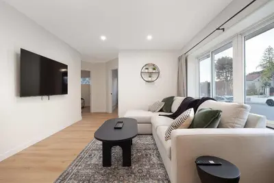 a living room with a couch and a tv at Spacious & Newly Renovated Villa in San Diego - Perfect for Families in San Diego