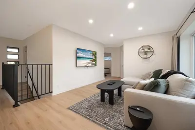 a living room with a couch and a table at Spacious & Newly Renovated Villa in San Diego - Perfect for Families in San Diego