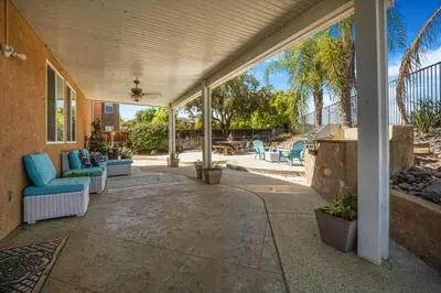 a patio with couches and chairs on a house at Your Home Away From Home near Wineries & Old Town in Murrieta