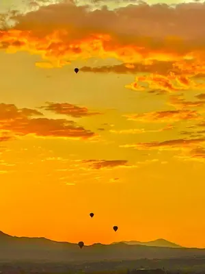 a group of kites flying in the sky at sunset at Your Home Away From Home near Wineries & Old Town in Murrieta