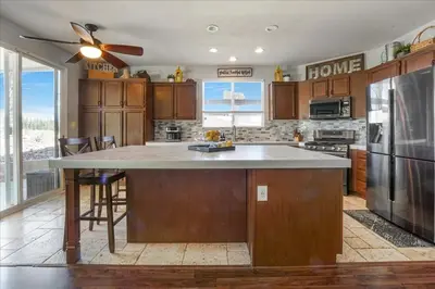 a kitchen with a large island in the middle at Your Home Away From Home near Wineries & Old Town in Murrieta
