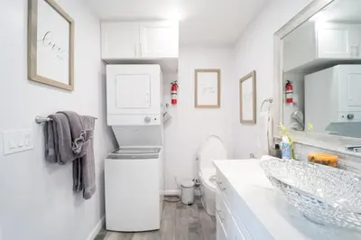 a white bathroom with a sink and a refrigerator at LOVE SHACK on private canyon, minutes to the Beach in San Diego