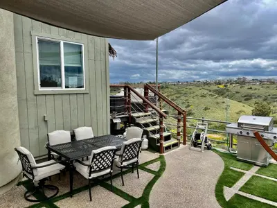 a patio with a table and chairs and a grill at LOVE SHACK on private canyon, minutes to the Beach in San Diego