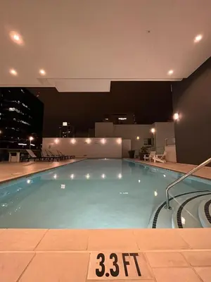 a large swimming pool in a building at night at Loft on 6th and Market in San Diego