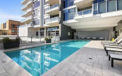 a swimming pool in front of a building at Loft on 6th and Market in San Diego