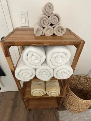 a pile of towels on a wooden shelf at Loft on 6th and Market in San Diego