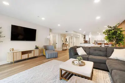 a living room with a couch and a tv at Bay View Penthauz Monthly Rental 2 parking spots in San Diego