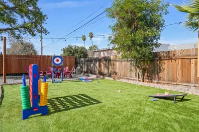 a small yard with a playground with a table at Sleeps 12 - Hot Tub - Pool - Game Room & Fire Pit! in Hemet