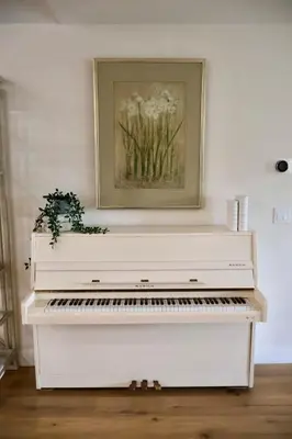 a white piano in a room with a painting on the wall at 2 Masters, Newly renovated with new furnishings - 4BR 3BA in San Diego