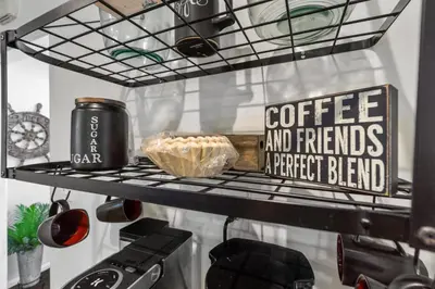 a shelf with a coffee andfriends a perfect blend sign at Bungalow Downtown Easy Airport Access Family Friendly in San Diego