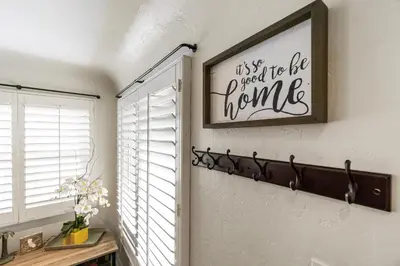 a room with a window and a picture on the wall at Bungalow Downtown Easy Airport Access Family Friendly in San Diego
