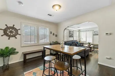 a dining room with a table and chairs in a room at Bungalow Downtown Easy Airport Access Family Friendly in San Diego