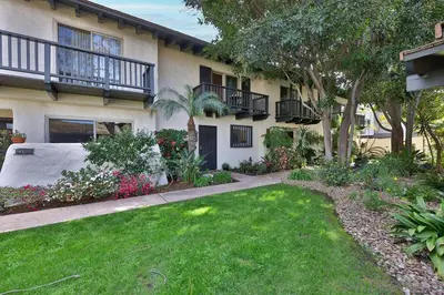 a house with a yard with grass and flowers at Spanish Style San Diego Home Near Beaches in San Diego
