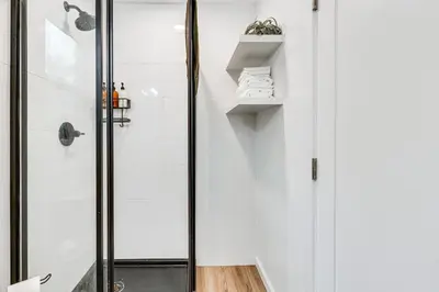 a bathroom with a shower and a glass door at Sip, Golf and Unwind Couples Retreat in Fallbrook in Fallbrook