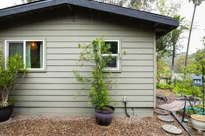 a small house with a potted tree in front of it at Sip, Golf and Unwind Couples Retreat in Fallbrook in Fallbrook