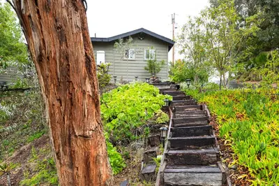 a garden with stone steps leading up to a house at Sip, Golf and Unwind Couples Retreat in Fallbrook in Fallbrook