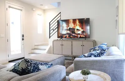 a living room with two couches and a flat screen tv at Central SD Townhome 2 King Beds Zoo DT North Park in San Diego