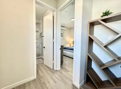 a hallway with a door leading to a bedroom at Central SD Townhome 2 King Beds Zoo DT North Park in San Diego
