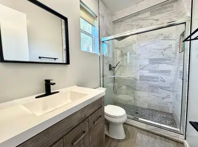 a bathroom with a sink and a shower at Central SD Townhome 2 King Beds Zoo DT North Park in San Diego