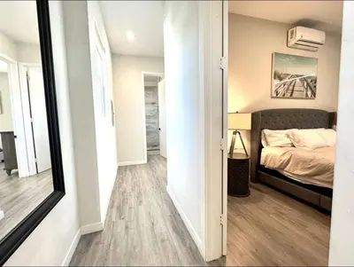 a small bedroom with a bed and a mirror at Central SD Townhome 2 King Beds Zoo DT North Park in San Diego