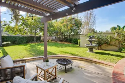 a patio with a fire pit in a yard at Quiet Carlsbad Home One and a Half Miles from the Beach in Carlsbad