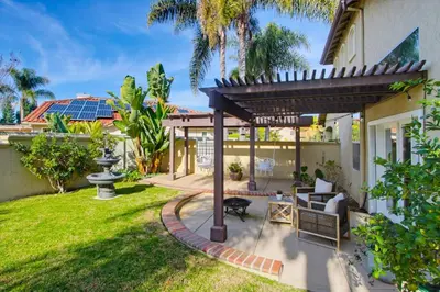 a garden with a pergola and a patio at Quiet Carlsbad Home One and a Half Miles from the Beach in Carlsbad
