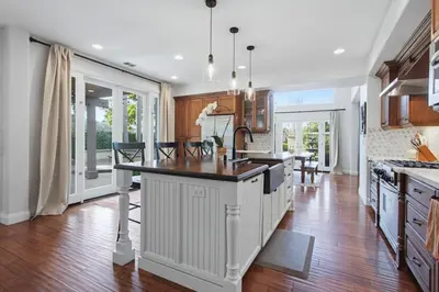a kitchen with a island in the middle of a room at Quiet Carlsbad Home One and a Half Miles from the Beach in Carlsbad