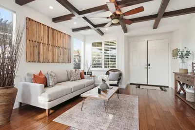 a living room with a couch and a ceiling fan at Quiet Carlsbad Home One and a Half Miles from the Beach in Carlsbad