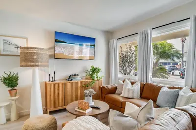 a living room with a couch and a table at Jewell Street Gem - 3 properties in 1 in San Diego