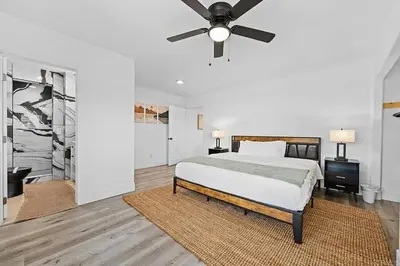 a bedroom with a bed and a ceiling fan at Mountains Views with Pool & Basketball, Relax & Play! in Escondido