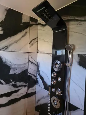a shower in a bathroom with a black and white at Mountains Views with Pool & Basketball, Relax & Play! in Escondido