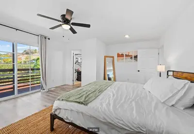 a bedroom with a bed and a ceiling fan at Mountains Views with Pool & Basketball, Relax & Play! in Escondido