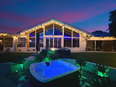 a large house with a hot tub in the yard at Private Pickleball Villa, Pool Oasis & Chic Casita in Fallbrook