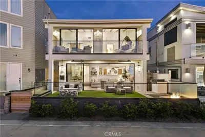 a large house with a large glass facade at Beachfront Sunset in San Diego