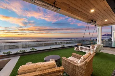 a balcony with a view of the ocean on a beach at Beachfront Sunset in San Diego