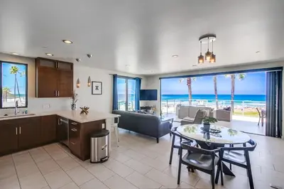 a kitchen and dining room with a view of the ocean at Ocean Park Combo 9 & 10 in San Diego