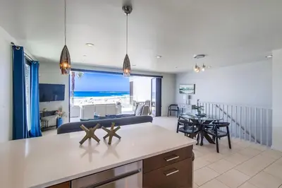 a kitchen and living room with a view of the ocean at Ocean Park Combo 9 & 10 in San Diego