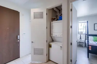 a kitchen with a refrigerator and an open door at Ocean Park Combo 9 & 10 in San Diego