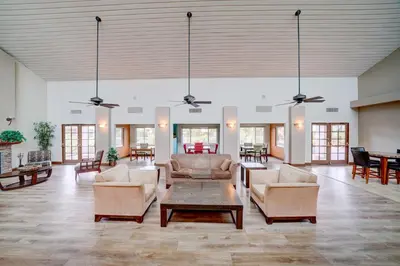 a large living room with couches and tables at La Jolla Lifestyle in San Diego