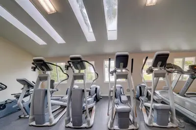a gym with treadmills and elliptical machines at La Jolla Lifestyle in San Diego