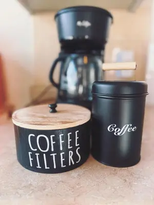 two coffee filters and cups sitting on a counter at Beach Getaway Apt - Walk to Sand & Bay in San Diego