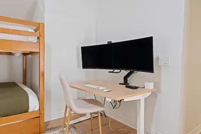 a desk with a monitor and a computer on it at Villa Tierra Alta - Pool, Spa, Movie Theater, Game Room in La Mesa