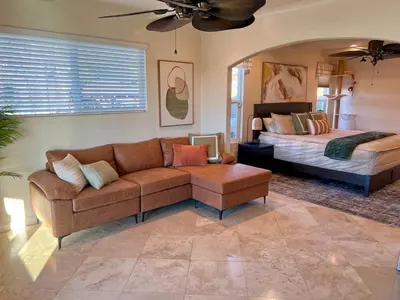 a living room with a couch and a bed at Granite Hills Sunset Villa in El Cajon